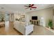 Bright and airy living space with tile floors, neutral walls, and views into the dining room at 340 Cedar Falls Dr, Apollo Beach, FL 33572