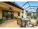 Inviting screened patio area with comfortable seating and serene outdoor views at 340 Cedar Falls Dr, Apollo Beach, FL 33572