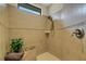 Modern walk-in shower with decorative tile accents, corner seat, and handheld shower head at 340 Cedar Falls Dr, Apollo Beach, FL 33572