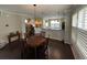 Dining area with round wooden table and chair set at 4707 Woodbrook Dr, Sarasota, FL 34243