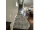 Staircase with patterned carpet runner leading to upper level at 4707 Woodbrook Dr, Sarasota, FL 34243