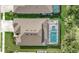 Overhead view of a house and pool with a fenced backyard at 10739 Spring Tide Way, Parrish, FL 34219