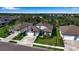 Home situated in a community with a lake and other houses at 10739 Spring Tide Way, Parrish, FL 34219