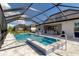 Resort-style pool with a spa and a spacious screened enclosure at 10739 Spring Tide Way, Parrish, FL 34219