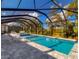 Relaxing pool area with a covered patio and lounge chairs at 10739 Spring Tide Way, Parrish, FL 34219