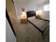 Cozy bedroom features neutral walls, carpet, and essential furnishings at 1208 44Th Avenue E Dr, Ellenton, FL 34222