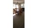 Dining room with wood table and four chairs and natural lighting at 1208 44Th Avenue E Dr, Ellenton, FL 34222