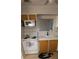 Compact kitchen featuring bright cabinets, modern appliances, and a cozy atmosphere at 1208 44Th Avenue E Dr, Ellenton, FL 34222