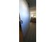 View of the living area featuring comfortable sofa from behind a sliding barn door at 1208 44Th Avenue E Dr, Ellenton, FL 34222