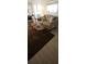 Comfortable living room featuring a plush sofa, chair, and patterned rug at 1208 44Th Avenue E Dr, Ellenton, FL 34222