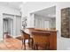 Home bar with wicker barstools and wood counter at 1954 Datura St, Sarasota, FL 34239