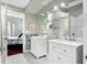 Elegant bathroom with double vanity and patterned floors at 1954 Datura St, Sarasota, FL 34239