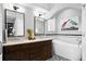 Bathroom with double vanity, free-standing bathtub, and subway tile at 1954 Datura St, Sarasota, FL 34239
