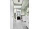 Elegant bathroom features double vanities and a black and white tile floor at 1954 Datura St, Sarasota, FL 34239
