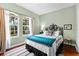 Guest bedroom with a queen-size bed and hardwood floors at 1954 Datura St, Sarasota, FL 34239