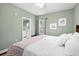Bright bedroom with king-size bed and ensuite bathroom at 1954 Datura St, Sarasota, FL 34239