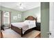 Spacious bedroom with wood-framed bed and soft rug at 1954 Datura St, Sarasota, FL 34239