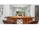 View of dining room through a pass-through window at 1954 Datura St, Sarasota, FL 34239