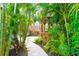 Wooden gazebo nestled amongst tropical foliage, ideal for outdoor relaxation at 1954 Datura St, Sarasota, FL 34239