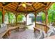 Covered gazebo with seating, offering shade and a view of the pool at 1954 Datura St, Sarasota, FL 34239