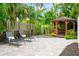 Relaxing gazebo with lounge chairs and brick paved patio at 1954 Datura St, Sarasota, FL 34239
