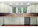 Kitchen features light cabinets, granite counters, and a dishwasher at 1954 Datura St, Sarasota, FL 34239
