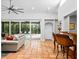 Bright living room with pool view, tile floors, and comfy seating at 1954 Datura St, Sarasota, FL 34239