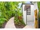 Brick pathway leads to private outdoor shower at 1954 Datura St, Sarasota, FL 34239