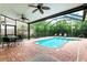 Screened-in pool and patio area with seating and a dining table at 1954 Datura St, Sarasota, FL 34239