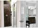Outdoor shower with stone tile and pebble floor at 1954 Datura St, Sarasota, FL 34239