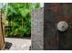 Outdoor shower with stone tile and lush landscaping at 1954 Datura St, Sarasota, FL 34239