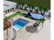 Relaxing pool area with a deck and spiral staircase at 303 65Th St # A, Holmes Beach, FL 34217