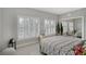 Bedroom featuring a patterned bedspread, white shutters and mirrored closet at 3927 Somerset Dr, Sarasota, FL 34242