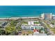 Aerial view of beach, building, and palm trees at 1080 Piedmont Rd, Venice, FL 34293