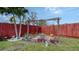 Cozy backyard patio with pergola, brick flooring, and potted plants at 1080 Piedmont Rd, Venice, FL 34293