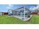 Inviting backyard with screened pool and patio area, perfect for relaxation at 1080 Piedmont Rd, Venice, FL 34293