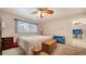 Comfortable bedroom with ceiling fan and dresser at 1080 Piedmont Rd, Venice, FL 34293