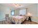 Comfortable bedroom with ceiling fan and access to sunroom at 1080 Piedmont Rd, Venice, FL 34293