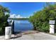 Boat ramp with calm water and lush greenery at 1080 Piedmont Rd, Venice, FL 34293