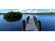 Wooden dock extending into calm waterway at 1080 Piedmont Rd, Venice, FL 34293