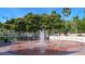 Circular fountain with benches surrounded by palm trees at 1080 Piedmont Rd, Venice, FL 34293