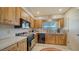 Well-equipped kitchen with ample cabinetry and modern appliances at 1080 Piedmont Rd, Venice, FL 34293