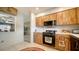 Modern kitchen with stainless steel appliances and breakfast bar at 1080 Piedmont Rd, Venice, FL 34293