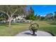 Scenic park with gazebo, lush landscaping, and a unique sculpture at 1080 Piedmont Rd, Venice, FL 34293