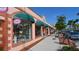 Upscale storefront with green awnings and attractive displays at 1080 Piedmont Rd, Venice, FL 34293