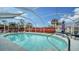 Relaxing swimming pool with screened enclosure and patio furniture at 1080 Piedmont Rd, Venice, FL 34293