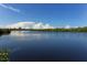 Serene waterway view with lush greenery and blue skies at 1080 Piedmont Rd, Venice, FL 34293