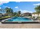 Inviting community pool with lounge chairs, surrounded by lush landscaping at 3202 60Th W Ave # 3202, Bradenton, FL 34207