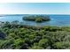 Aerial view showcasing waterfront property and lush landscaping at 396 Aruba Cir # 103, Bradenton, FL 34209