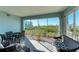 Relaxing screened porch with outdoor furniture and scenic views at 396 Aruba Cir # 103, Bradenton, FL 34209